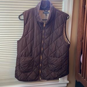 Brown puffy vest with gold zipper